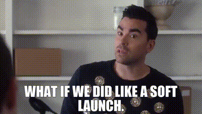 image of a white man with black hair wearing a black sweater with white circles on the front. He is saying, "What if we did, like, a soft launch?"